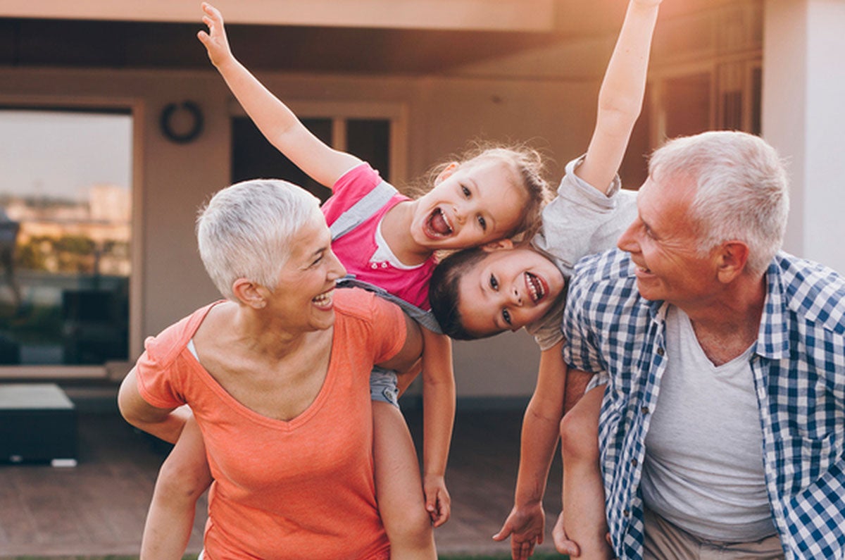 Grandparents giving piggyback ride